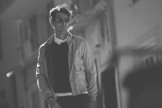 Man wearing Fedeli Italian menswear jacket in a refined street style look.