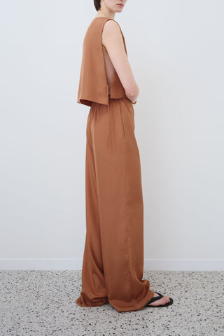 Side view of HERTH Ariel crop top and Jody trousers in earth habotai silk — timeless Italian womenswear available at ASSOLUTO boutique.