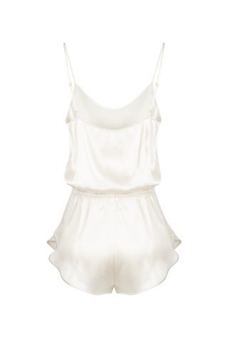 Back view of HERTH Janis short silk romper bodysuit in Almond, crafted in Italy from GOTS-certified organic silk. Available at ASSOLUTO boutique.