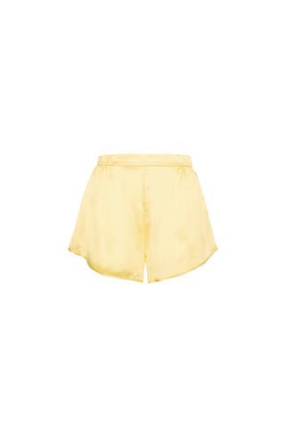 HERTH Yari silk shorts in Yellow Butter, crafted in Italy from GOTS-certified organic silk. Available at ASSOLUTO boutique.
