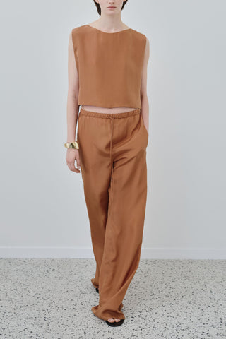 HERTH Jody silk trousers in Earth, crafted in Italy from GOTS-certified organic silk habotai. Available at ASSOLUTO boutique.