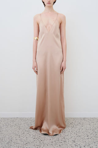 Front view of HERTH Inez slip dress in Sand organic silk — elegant sustainable womenswear crafted in Italy, available at ASSOLUTO boutique.