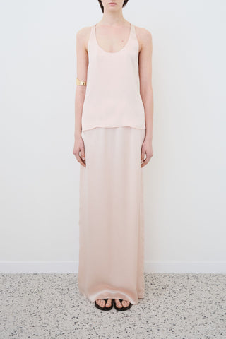 Front view of HERTH Nilde maxi skirt in Whisper Pink organic silk — timeless sustainable Italian design, available at ASSOLUTO boutique.