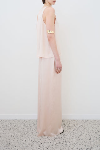 Side view of HERTH Nilde maxi skirt in Whisper Pink organic silk — elegant sustainable fashion made in Italy, available at ASSOLUTO boutique.