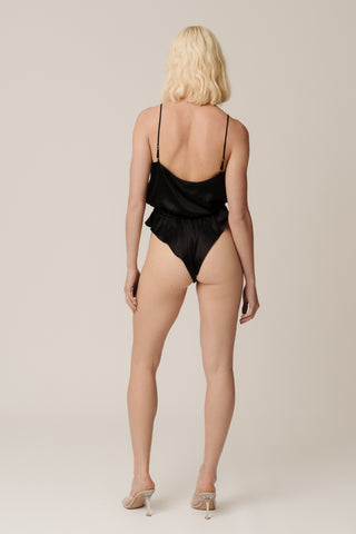 Back view of HERTH Nyx bodysuit in Black organic silk — minimalist sustainable lingerie-inspired design made in Italy, available at ASSOLUTO boutique.