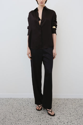 HERTH Tilde shirt and Zeno trousers in black organic silk — front view of sustainable Italian womenswear, available at ASSOLUTO boutique.